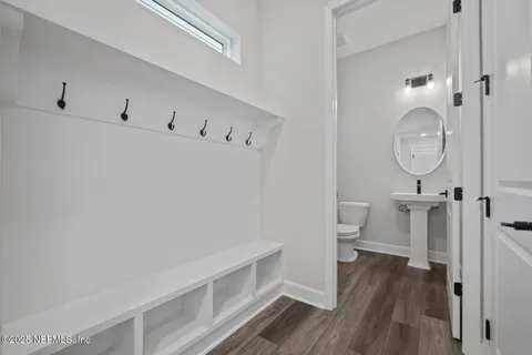 a view of a bathroom with wooden floor