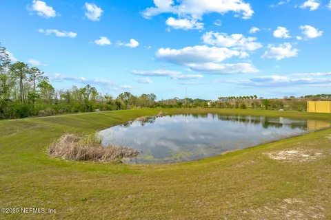 a view of a lake with a big yard