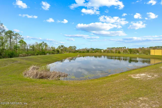 a view of a lake with a big yard