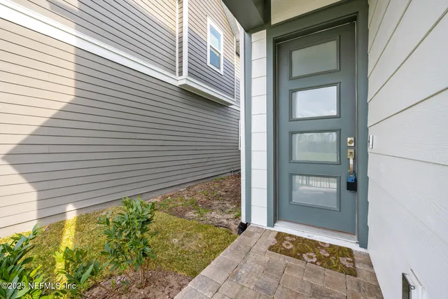 a view of house with backyard