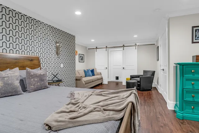 a bedroom with furniture and a couch