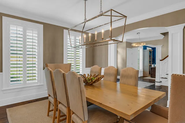 a view of a dining room with furniture and window