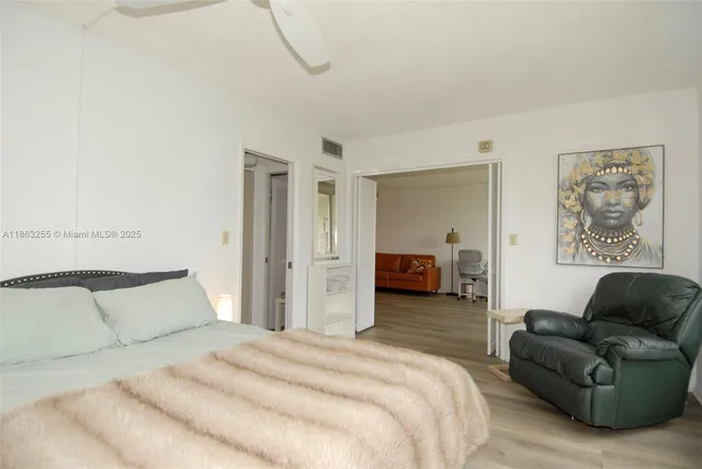 a bedroom with a bed and a couch