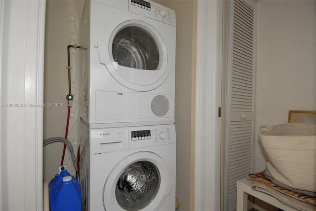 a close view of a utility room with dryer and washer