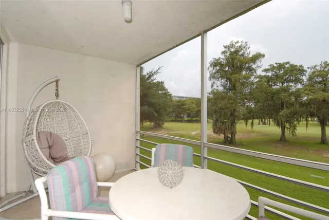 a room with furniture and a large window