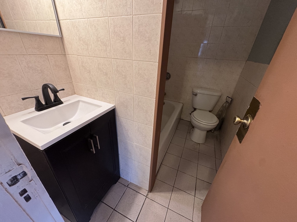 43-45 Cheney Street, Unit 3 Boston, MA 02121 - Photo 6 of 16 a bathroom with a sink and a toilet