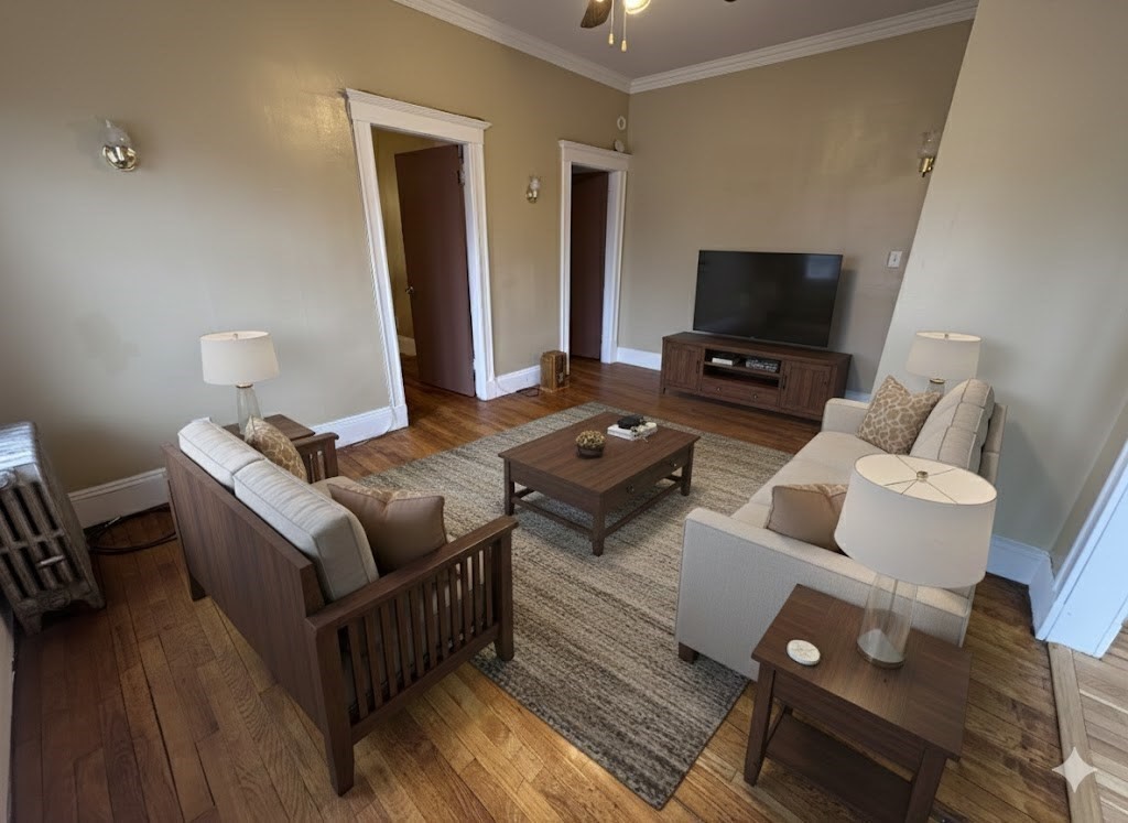 43-45 Cheney Street, Unit 3 Boston, MA 02121 - Photo 8 of 16 a living room with furniture and a flat screen tv