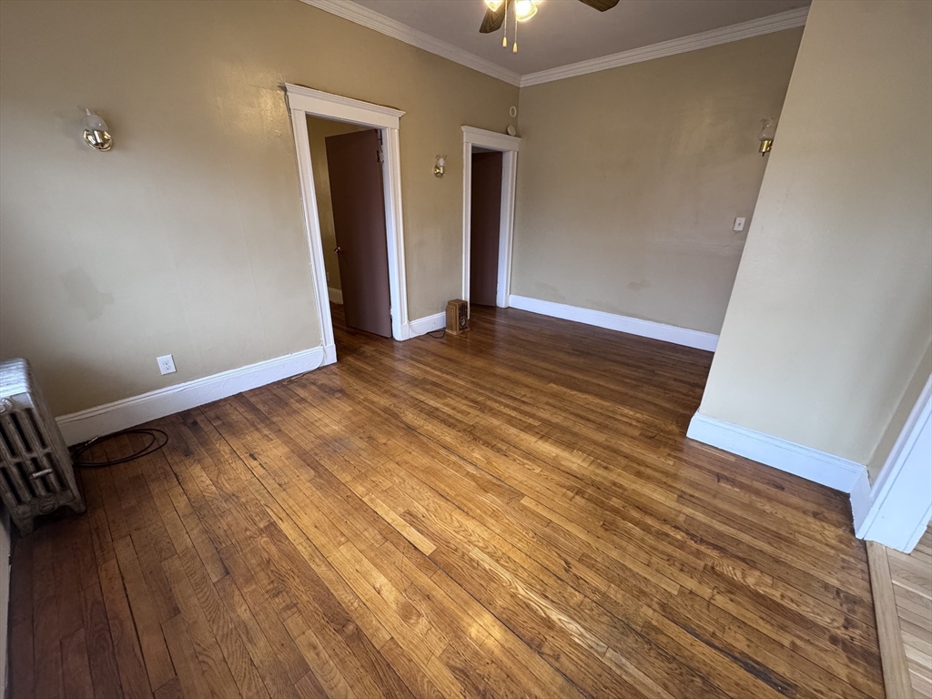 43-45 Cheney Street, Unit 3 Boston, MA 02121 - Photo 9 of 16 wooden floor in an empty room