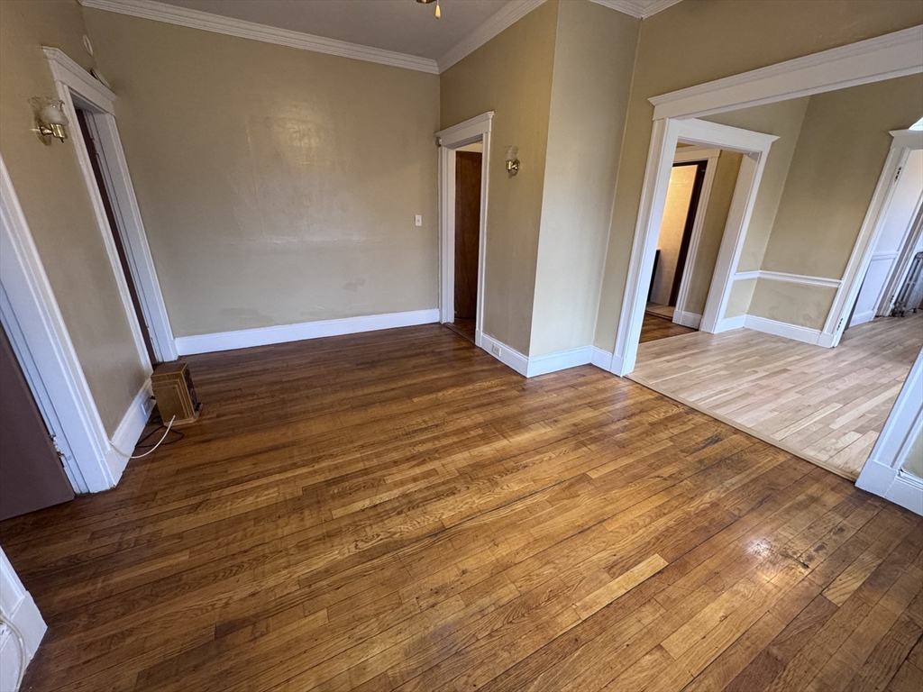 43-45 Cheney Street, Unit 3 Boston, MA 02121 - Photo 10 of 16 wooden floor in an empty room