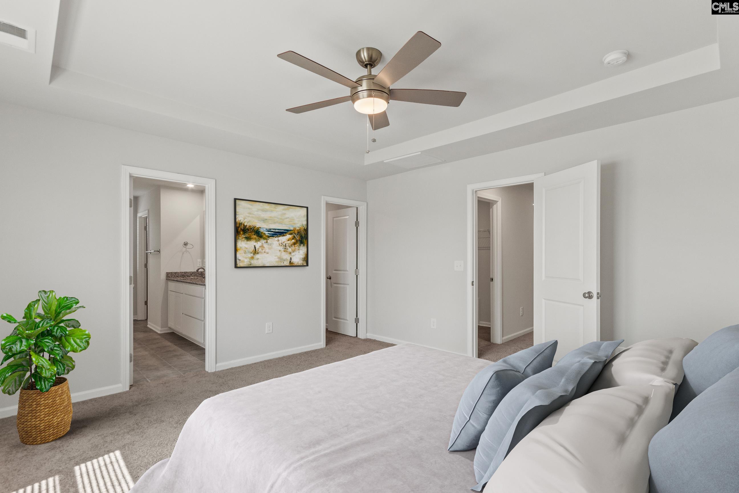 320 Brass Billion Path Lexington, SC 29073 - Photo 39 of 39 a bedroom with a bed and a chandelier