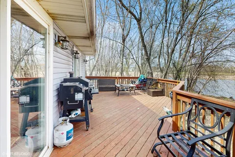 a view of a patio with wooden floor