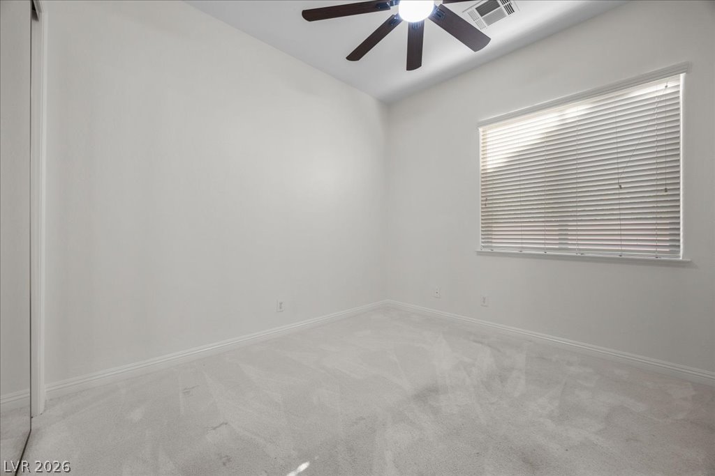 2125 De Rouge Avenue Henderson, NV 89044 - Photo 54 of 96 A well-lit bedroom offering a blank canvas for personal design and comfortable living.