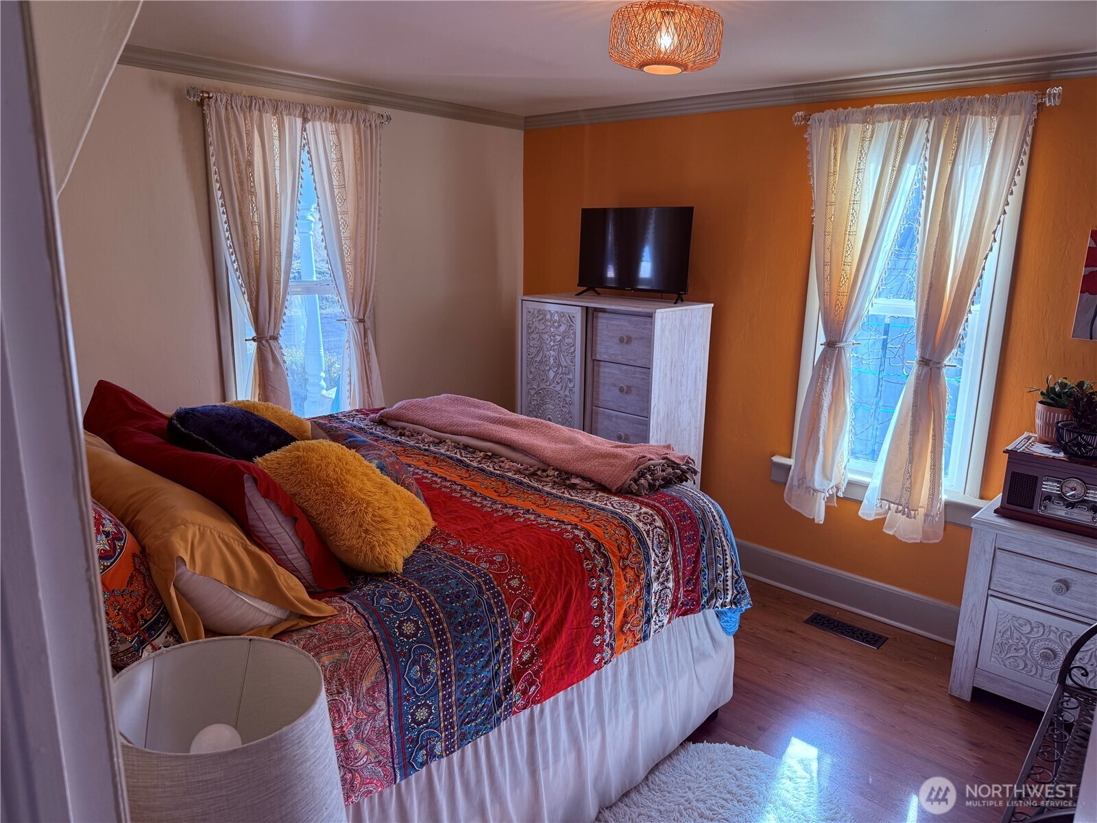514 South Division Street Odessa, WA 99159 - Photo 18 of 40 a bedroom with a bed and wooden floor