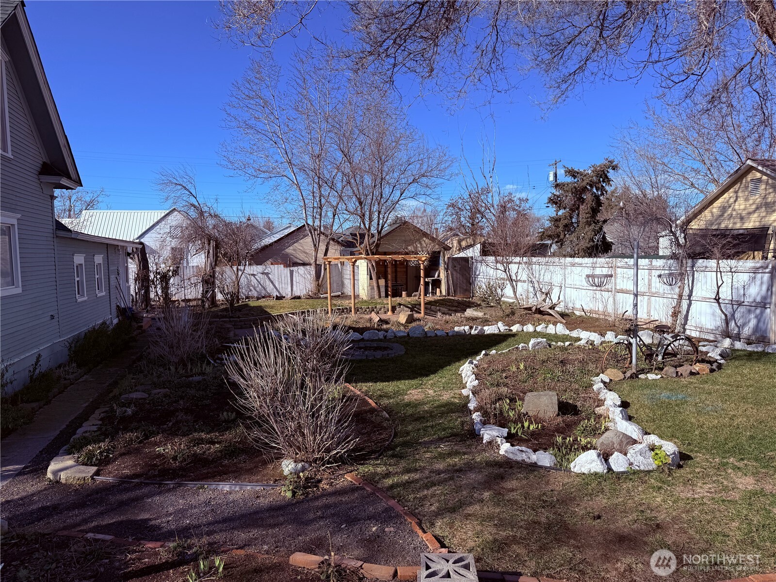 514 South Division Street Odessa, WA 99159 - Photo 27 of 40 a view of a house with a yard covered with snow