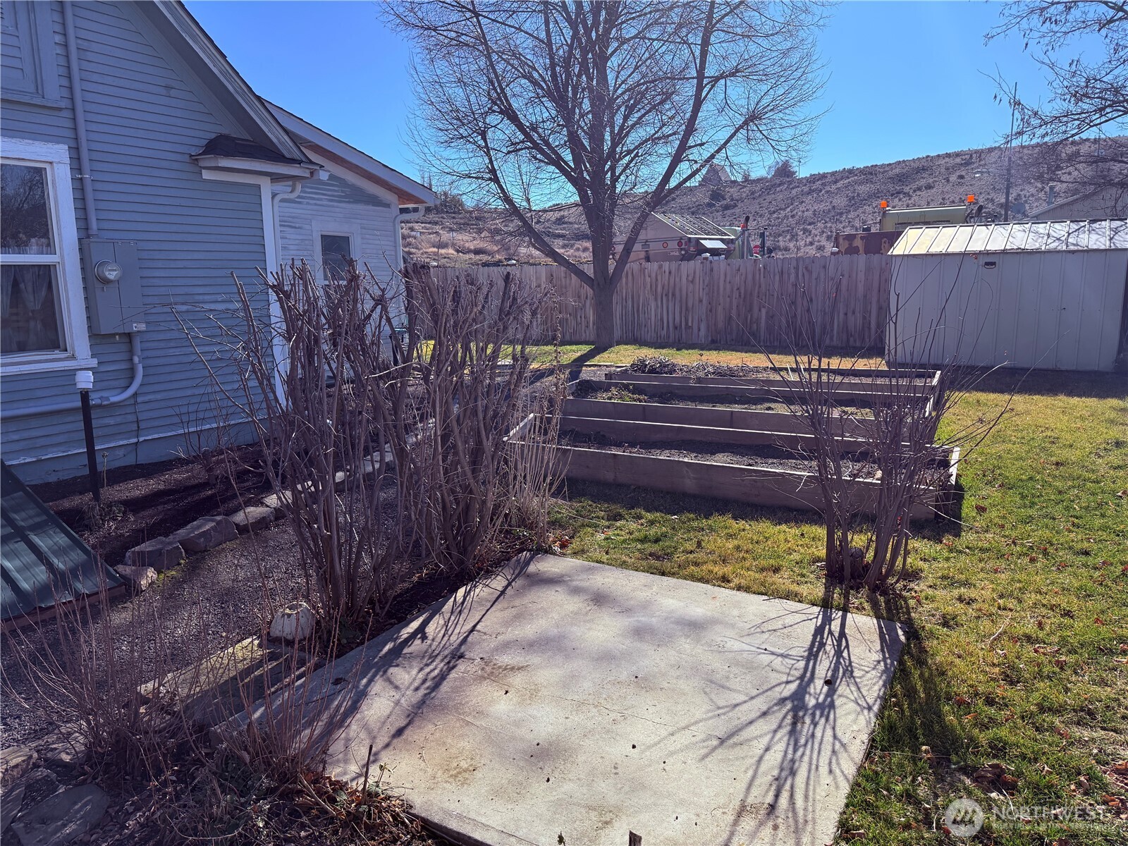 514 South Division Street Odessa, WA 99159 - Photo 30 of 40 a view of a backyard with a bench in the patio