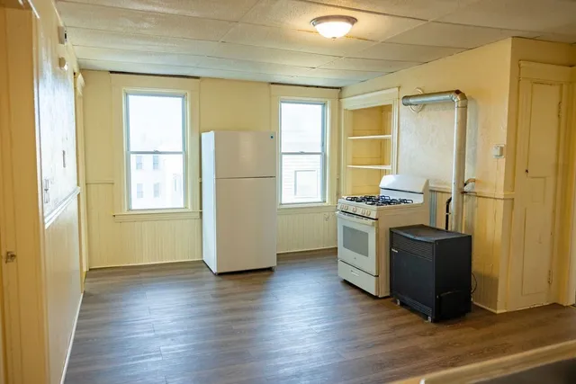a view of kitchen and wooden floor