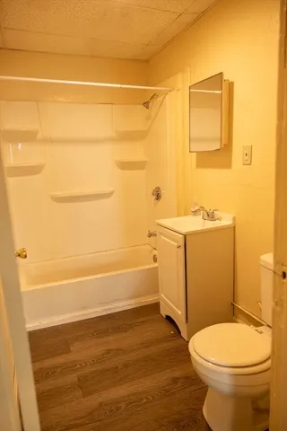 a bathroom with a toilet and a sink