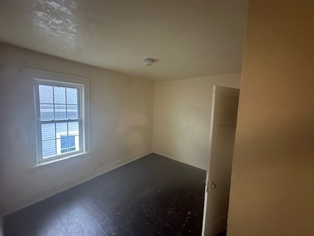 42 Dorcester, Unit 3 Worcester, MA 01604 - Photo 6 of 10 an empty room with windows