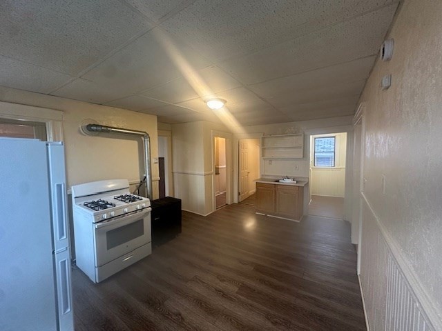 42 Dorcester, Unit 3 Worcester, MA 01604 - Photo 8 of 10 a kitchen with granite countertop a stove and a refrigerator