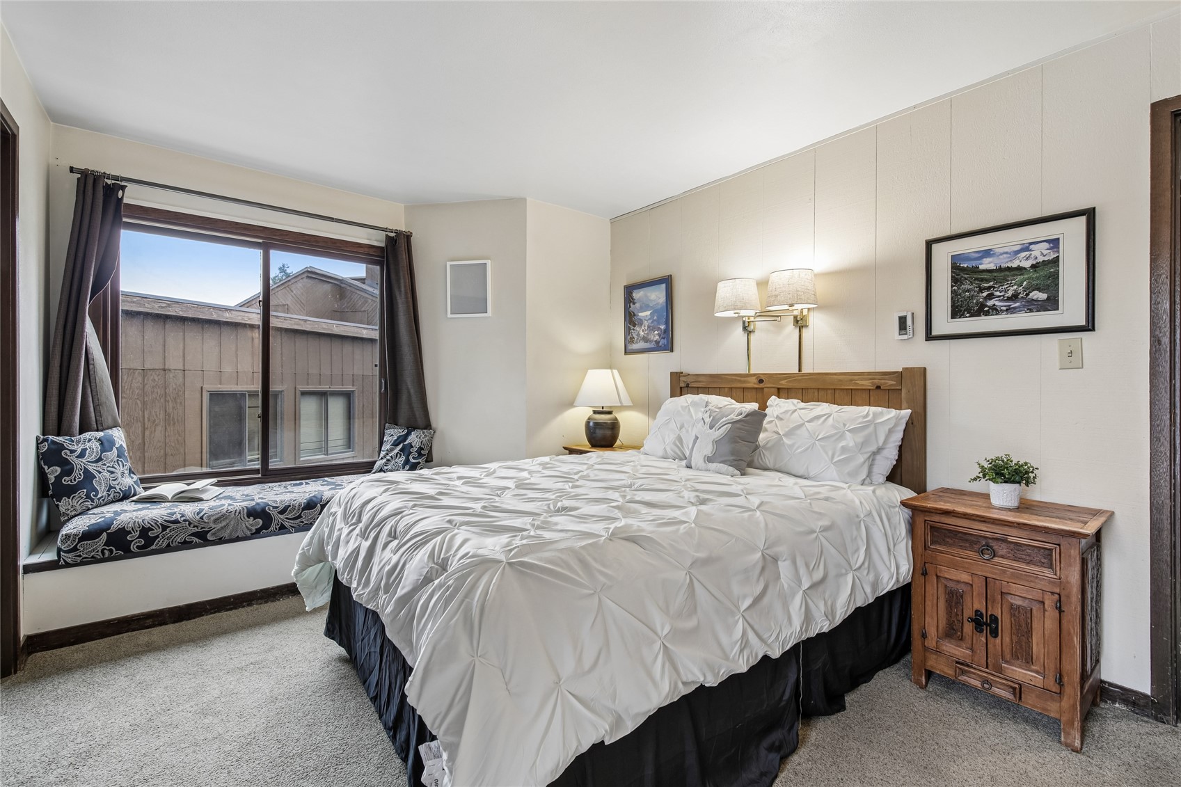 423 Wild Irishman Road, Unit 1008 1009 Keystone, CO 80435 - Photo 2 of 28 a bedroom with a bed and a large window