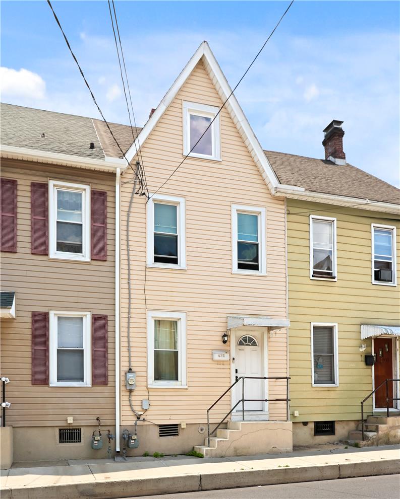 431 Pierce Street Bethlehem, PA 18015 - Photo 3 of 27 A charming, traditional facade features multiple windows and a welcoming front entrance.