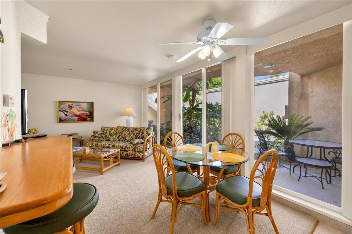 1555 North Chaparral Road, Unit 334 Palm Springs, CA 92262 - Photo 11 of 36 a dining room with furniture potted plants and wooden floor