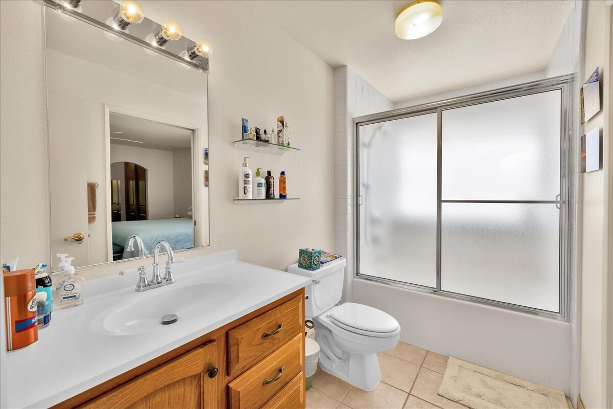 1555 North Chaparral Road, Unit 334 Palm Springs, CA 92262 - Photo 18 of 36 a bathroom with a sink a toilet and shower