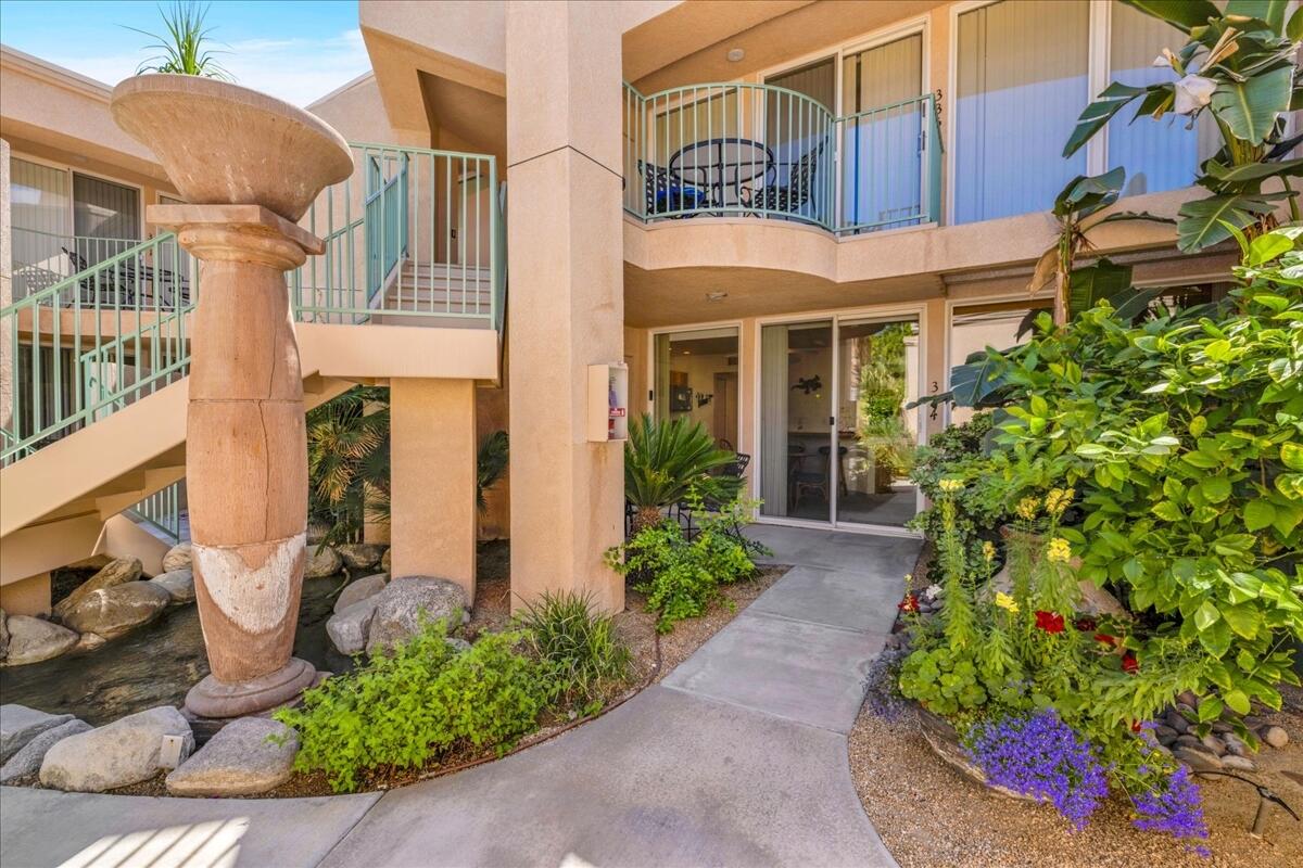 1555 North Chaparral Road, Unit 334 Palm Springs, CA 92262 - Photo 21 of 36 a front view of a house with garden
