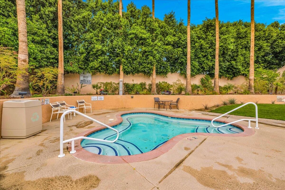 1555 North Chaparral Road, Unit 334 Palm Springs, CA 92262 - Photo 28 of 36 swimming pool with outdoor seating