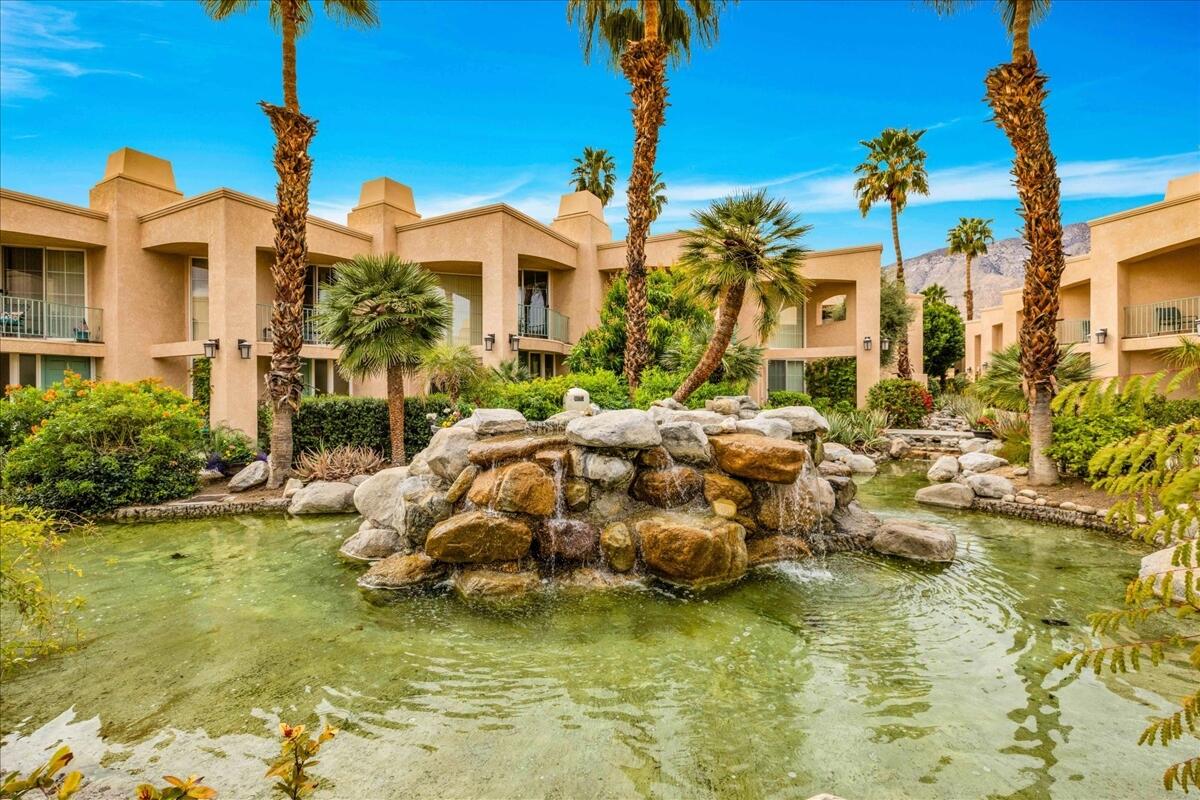 1555 North Chaparral Road, Unit 334 Palm Springs, CA 92262 - Photo 3 of 36 a view of a lake with a building in the background