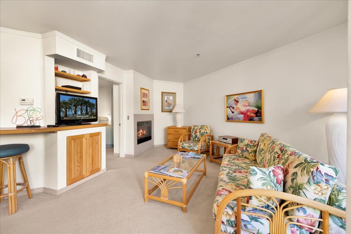 1555 North Chaparral Road, Unit 334 Palm Springs, CA 92262 - Photo 5 of 36 a living room with furniture and a flat screen tv