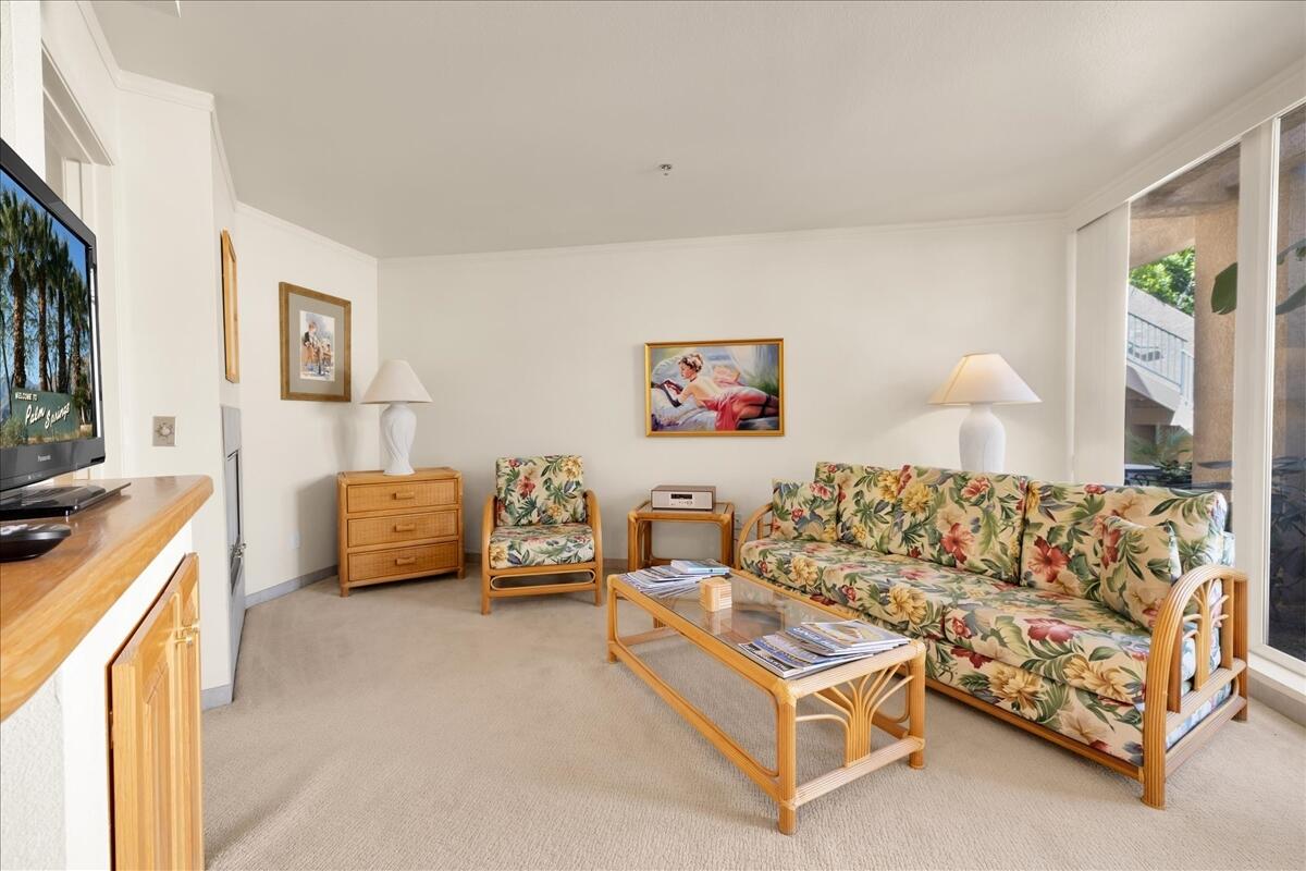 1555 North Chaparral Road, Unit 334 Palm Springs, CA 92262 - Photo 6 of 36 a living room with furniture and a couch