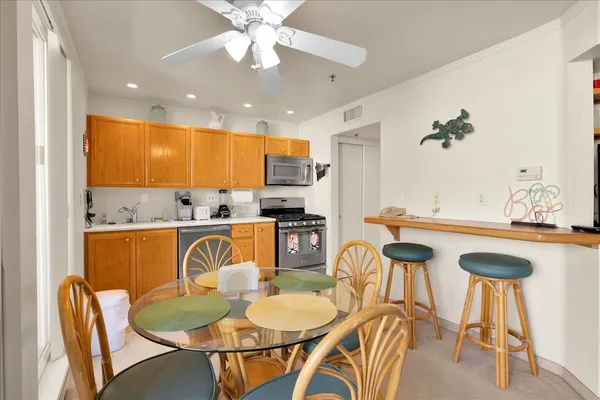 a view of a dining room with furniture and wooden floor