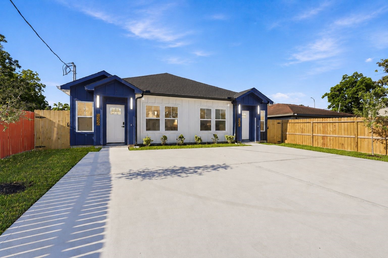 4606 Mallow Street, Unit B Houston, TX 77051 - Photo 2 of 25 a front view of a house with a yard and garage