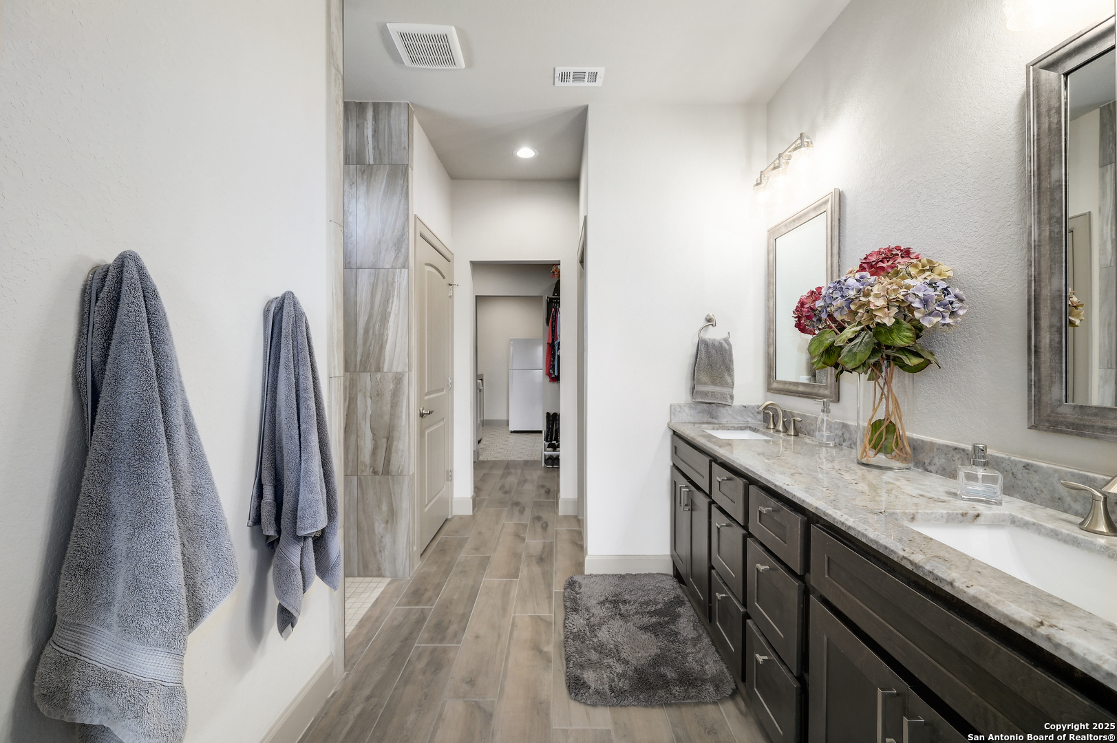 119 Hiram Cook Blanco, TX 78606 - Photo 8 of 20 a spacious bathroom with a granite countertop sink a mirror and a shower
