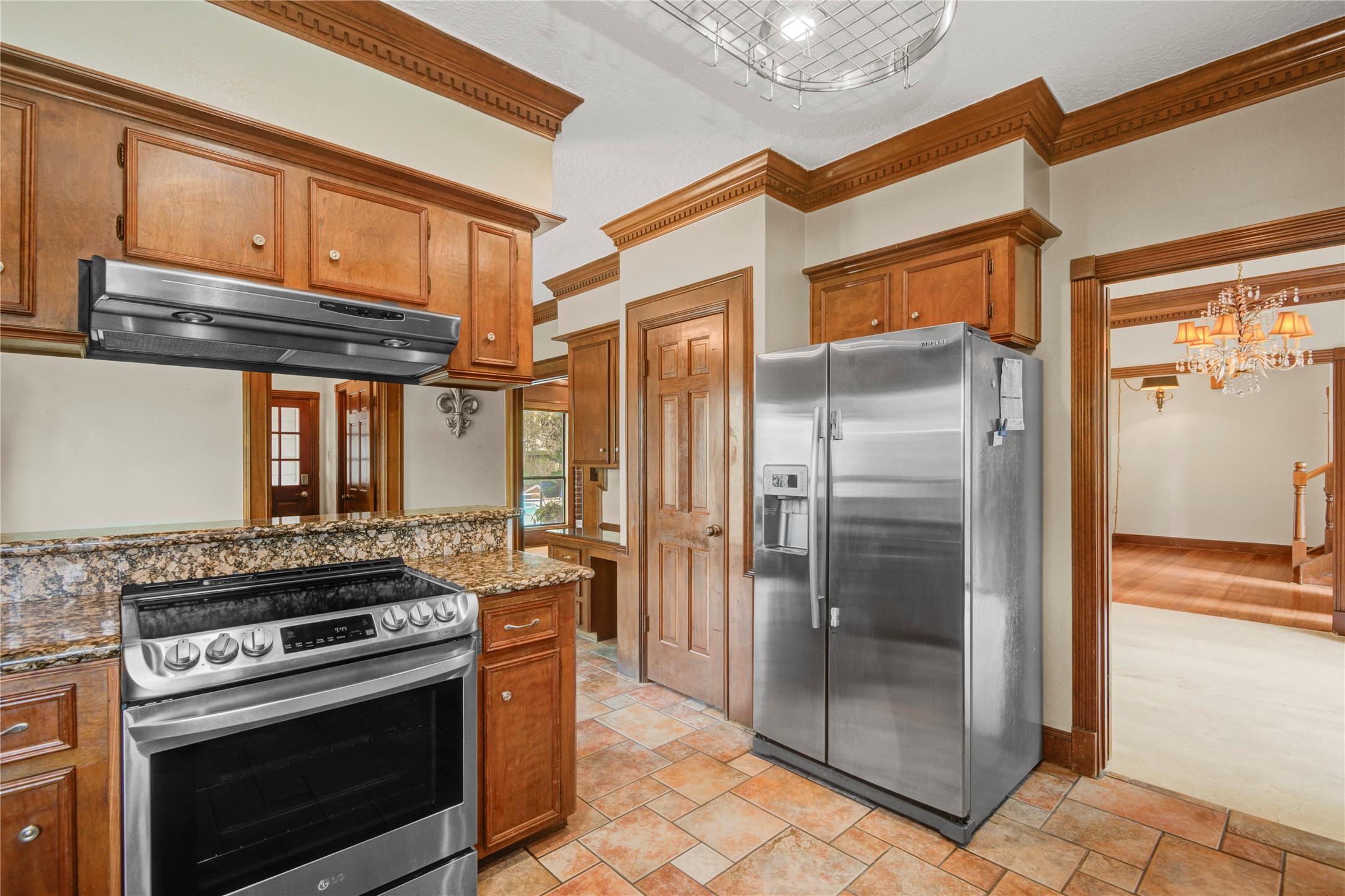 8412 Hidden Trail Lane Spring, TX 77379 - Photo 16 of 43 Another view of the spacious kitchen highlights extensive cabinetry, granite countertops, and stainless appliances designed for both everyday living and entertaining.