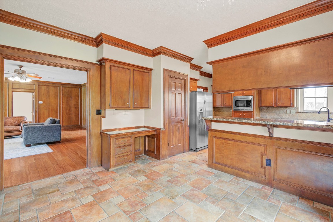 8412 Hidden Trail Lane Spring, TX 77379 - Photo 18 of 43 From the breakfast area, the open layout flows seamlessly toward the inviting family room, creating a comfortable space for gathering and conversation.