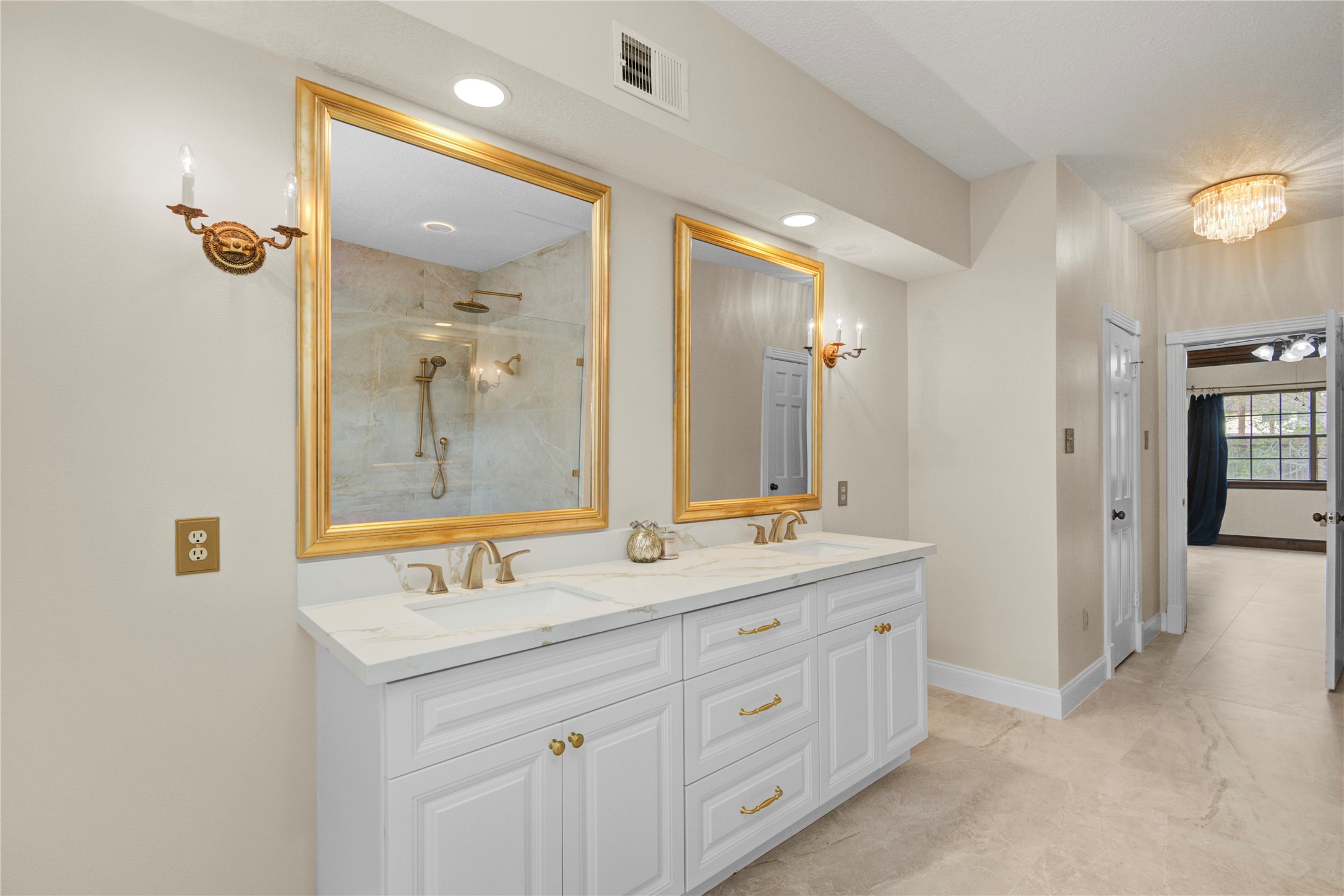 8412 Hidden Trail Lane Spring, TX 77379 - Photo 21 of 39 This updated ensuite bath offers extensive counter space, stylish finishes, and a bright, spa-inspired atmosphere.