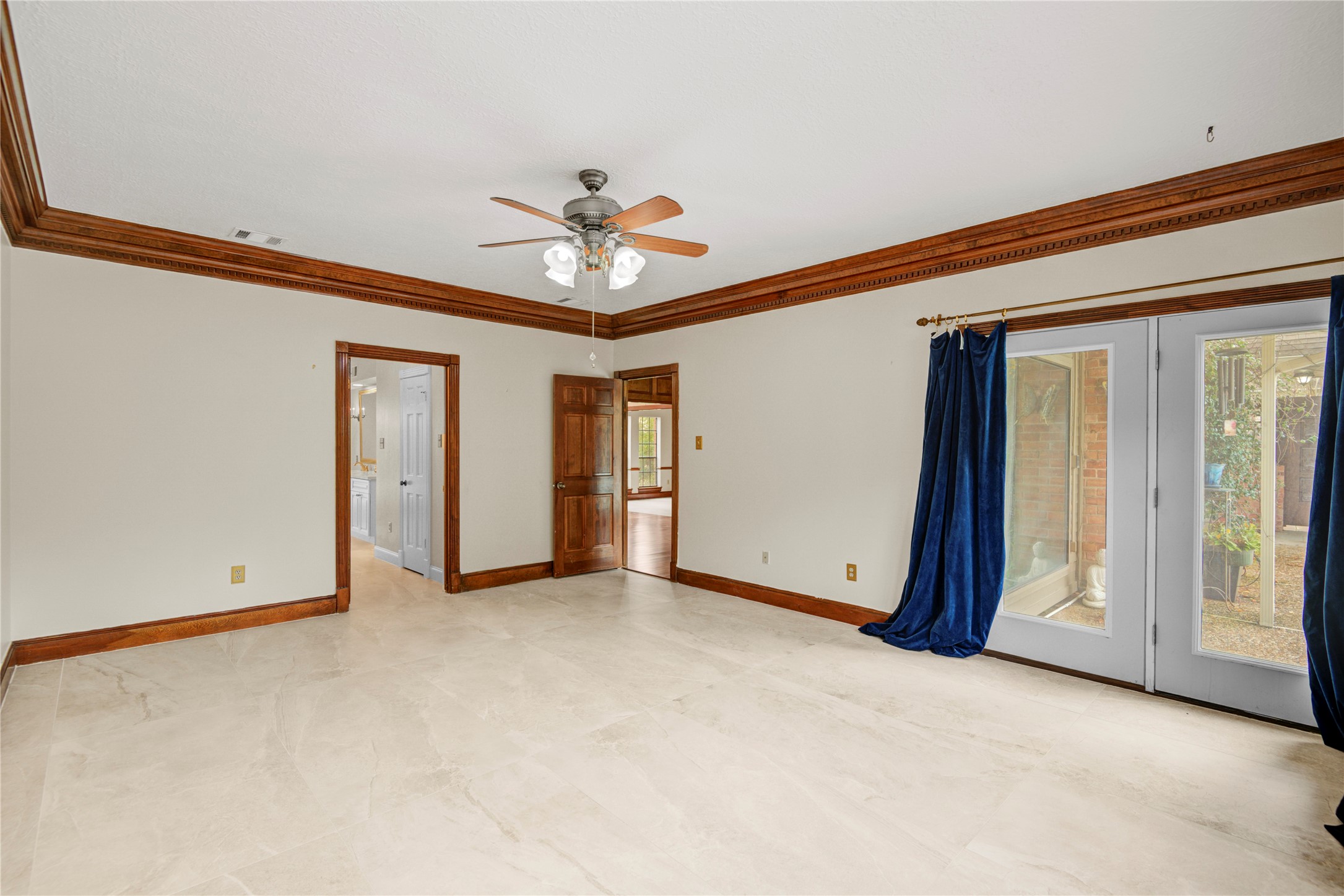 8412 Hidden Trail Lane Spring, TX 77379 - Photo 24 of 43 An alternate view of the primary suite highlights the generous layout and large windows that fill the room with natural light.