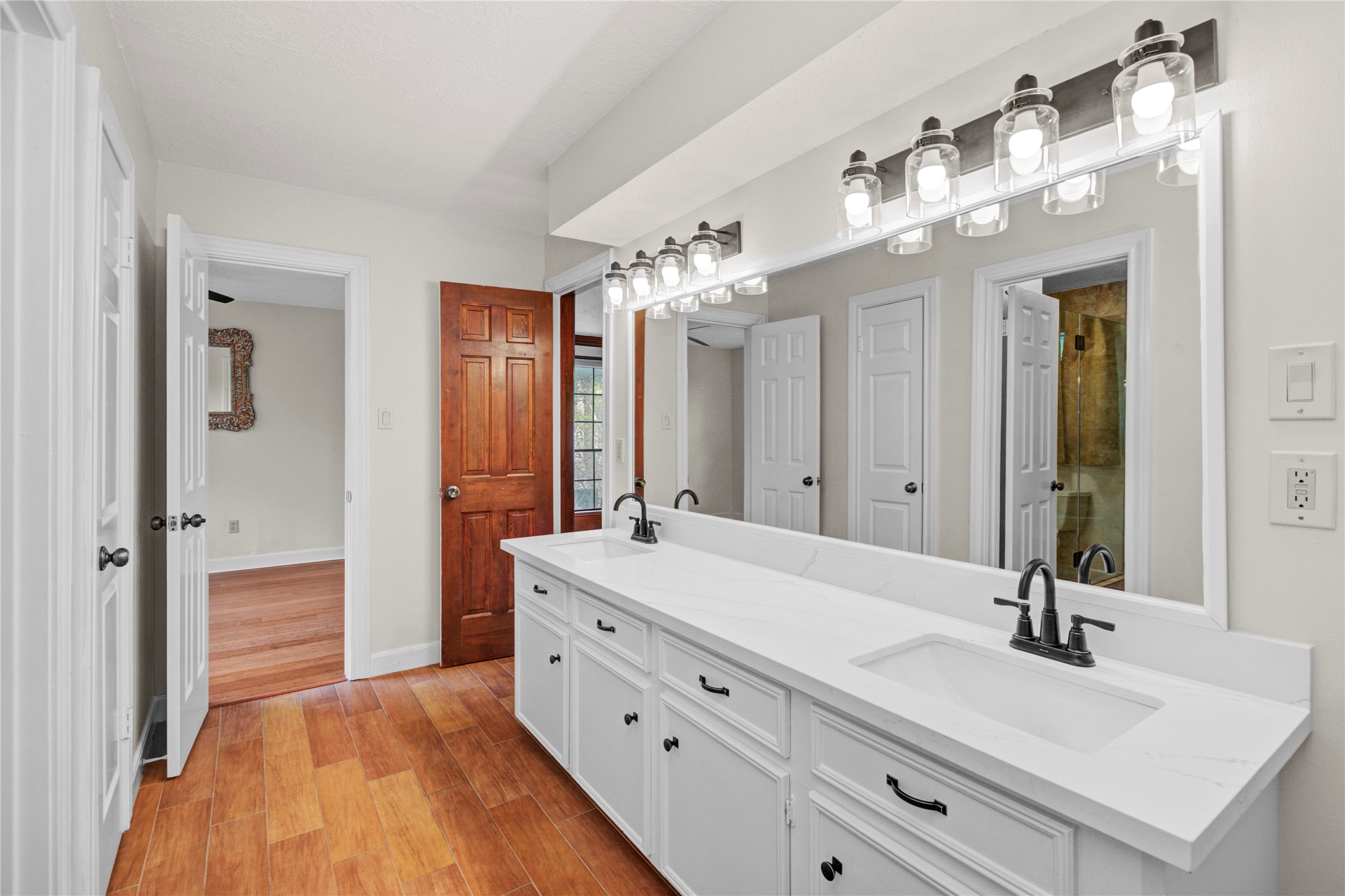 8412 Hidden Trail Lane Spring, TX 77379 - Photo 35 of 43 The shared Jack and Jill bathroom also features a beautifully updated walk-in shower, offering both style and convenience for adjoining bedrooms.