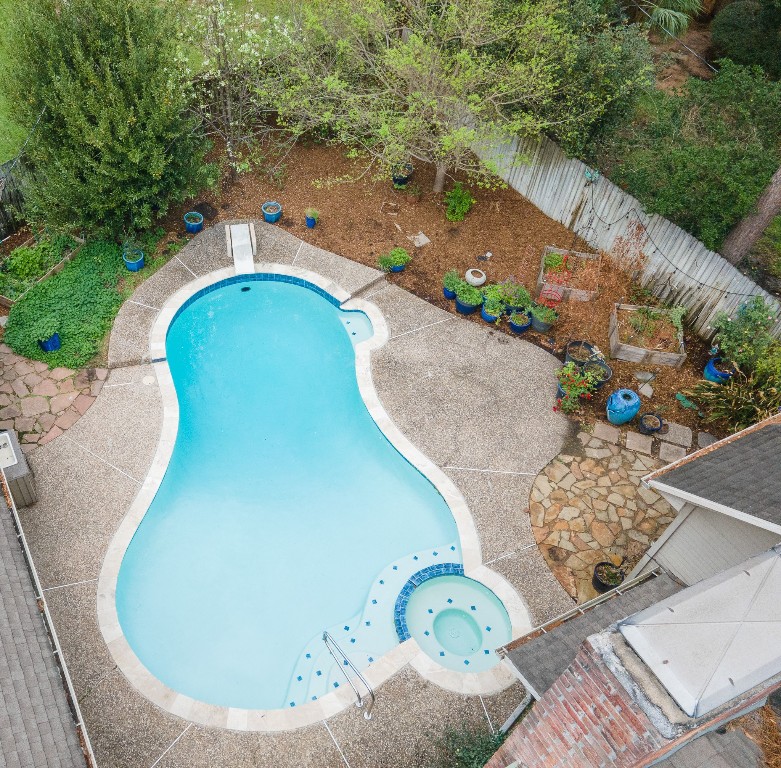 8412 Hidden Trail Lane Spring, TX 77379 - Photo 38 of 43 An overhead view showcases the inviting pool and spa layout nestled within the backyard’s natural surroundings.