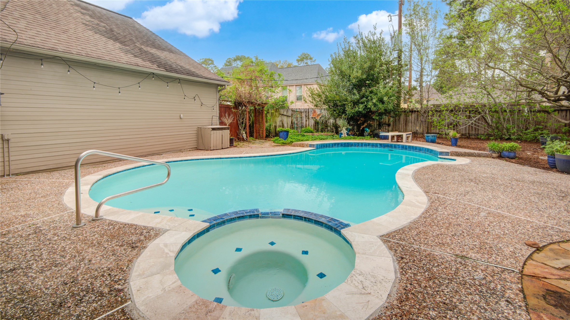 8412 Hidden Trail Lane Spring, TX 77379 - Photo 39 of 43 The pool and attached spa provide the perfect place to unwind while enjoying the tranquility of the backyard.