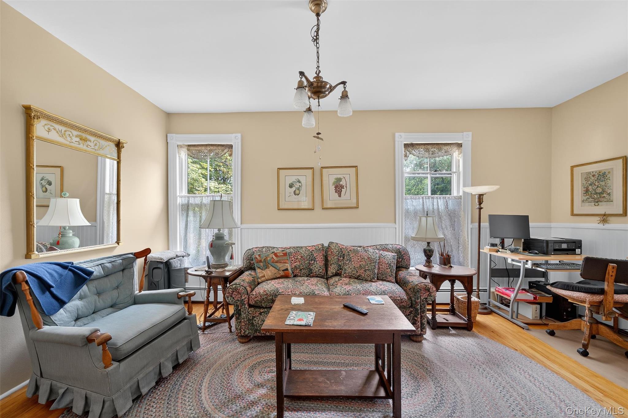 69 Smith Hill Road Airmont, NY 10952 - Photo 15 of 35 a living room with furniture a ceiling fan and a window