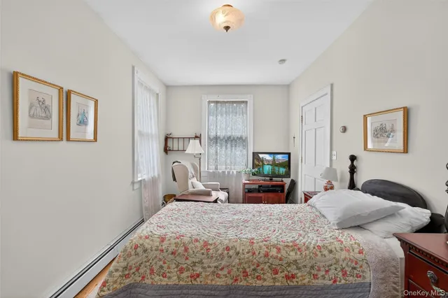 a bedroom with bed and window