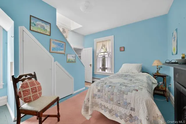 a bedroom with furniture and a chair