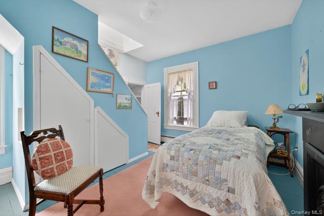 69 Smith Hill Road Airmont, NY 10952 - Photo 20 of 35 a bedroom with furniture and a chair