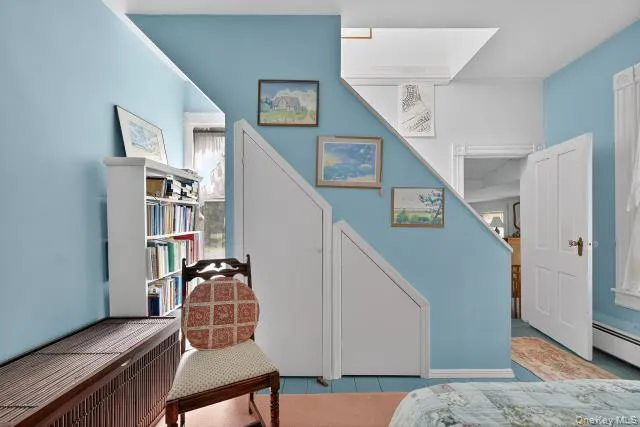 a view of a livingroom with furniture and staircase
