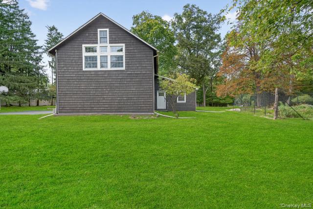 69 Smith Hill Road Airmont, NY 10952 - Photo 27 of 35 a front view of a house with a yard
