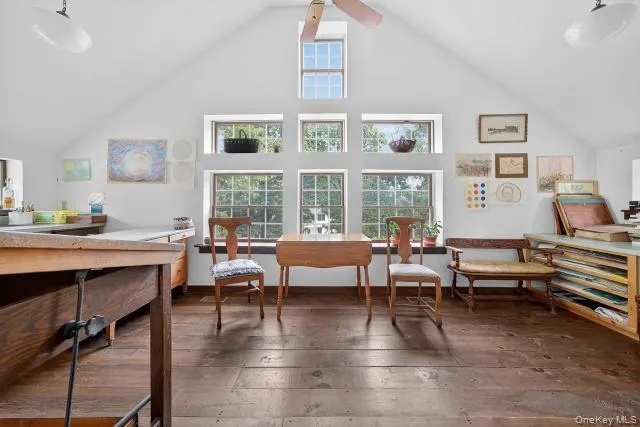 a living room with furniture and floor to ceiling window