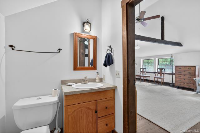69 Smith Hill Road Airmont, NY 10952 - Photo 34 of 35 a en suite bathroom with a toilet sink and mirror